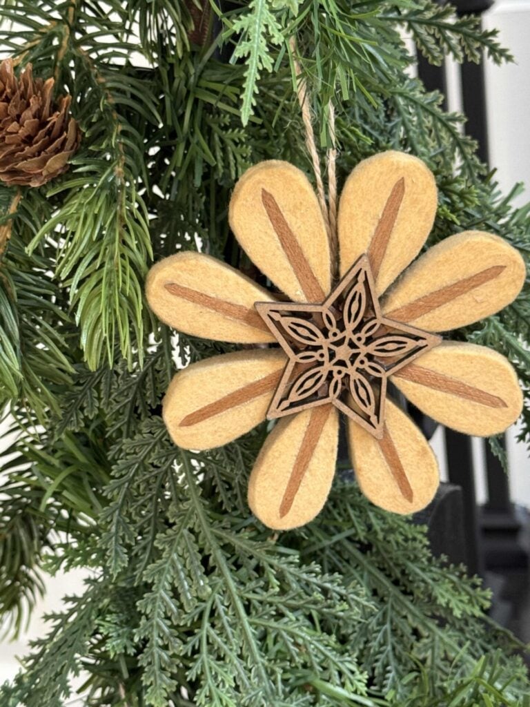 DIY flower Christmas ornaments made from piano hammers. and wood cut-out stars. 