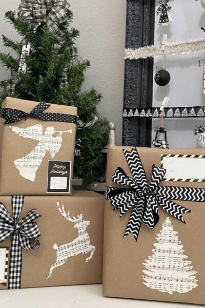 Christmas gifts wrapped in brown craft paper with sheet music tags.
