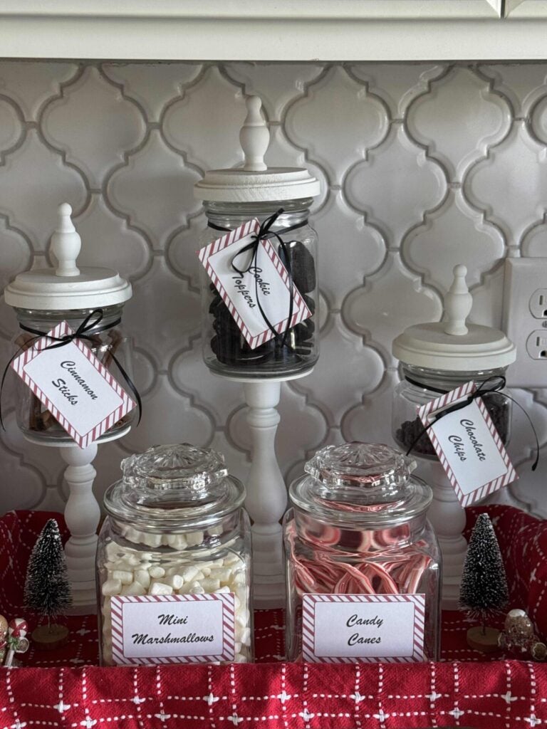Lidded jars filled with items for a hot chocolate bar. 