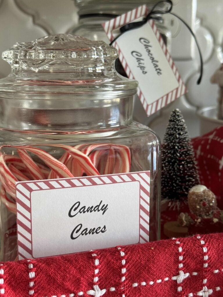 Candy canes stored in a lidded glass jar. 
