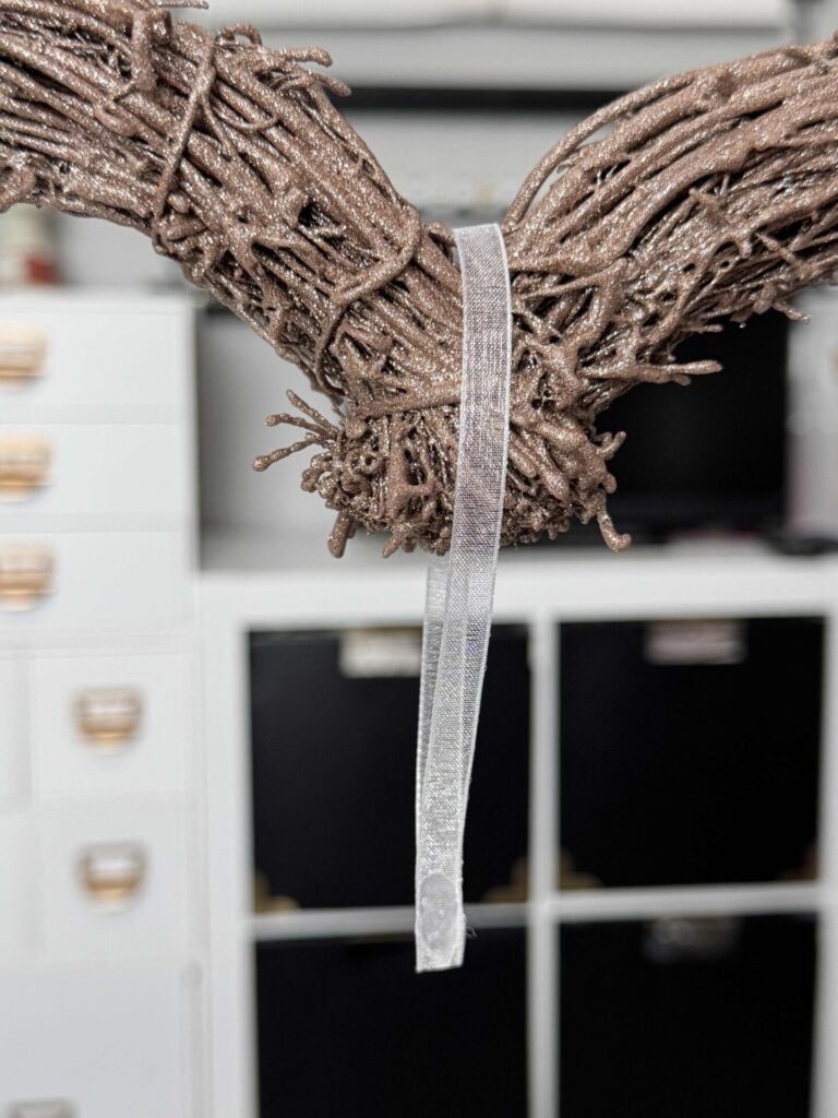 A piece of organza ribbon hanging over the heart. 