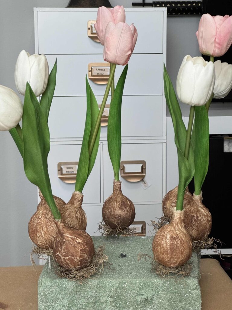 DIY faux tulip bulbs with moss attached to the bottom. 