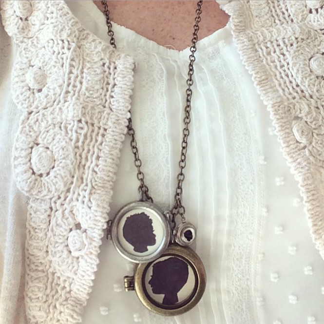 A woman wearing a DIY silhouette locket necklace, a great gift for Mother's Day. .