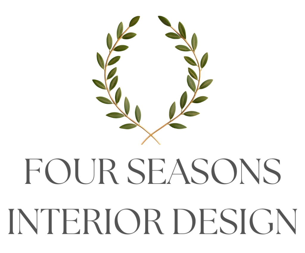 A logo with two crossed olive branches forming a wreath above the words FOUR SEASONS INTERIOR DESIGN in elegant, uppercase gray font on a white background, evoking the fresh, timeless appeal of coastal decor.