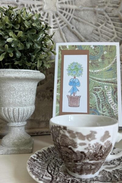 DIY handmade card with topiary stamp, patterned and solid card stock, and colored with chalk.