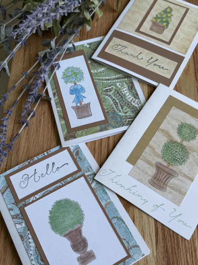 A set of handmade cards with topiary stamps that were colored with blending chalks.