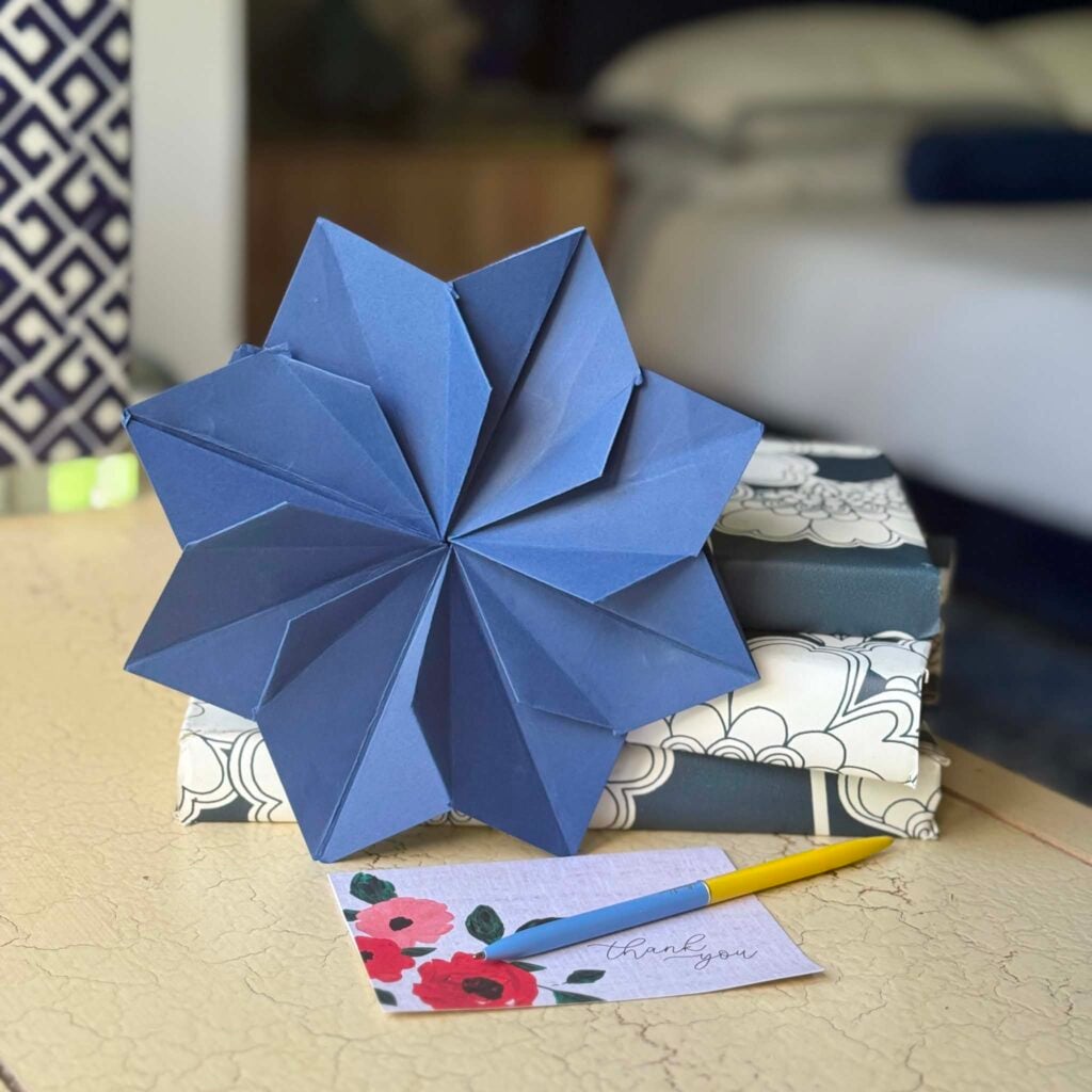 A blue origami flower envelope. 